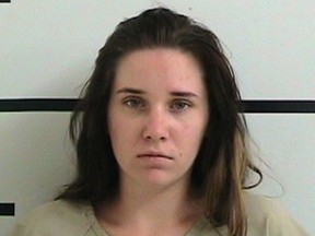 This undated photo provided by the Kerr County Jail shows Amanda Kristene Hawkins, who pleaded guilty Monday, Sept. 24, 2018, in Kerrville, Texas, to two counts each of child abandonment, child endangerment and injury to a child in the June 2017 deaths of her two daughters.