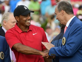 Tiger Woods is congratulated after winning the Tour Championship golf tournament Sunday, Sept. 23, 2018, in Atlanta. It was his first victory in more than five years, dating to the 2013 Bridgestone Invitational.