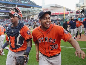 Hector Rondon, right, of the Houston Astros celebrates defeating the Cleveland Indians 11-3 in Game Three of the American League Division Series to advance to the American League Championship Series at Progressive Field on October 8, 2018 in Cleveland, Ohio. (Gregory Shamus/Getty Images)