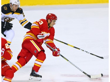 The Calgary Flames Johnny Gaudreau takes the puck up ice during NHL third period action against the Boston Bruins at the Scotiabank Saddledome in Calgary on Wednesday October 17, 2018.