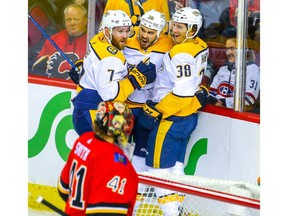 Nashville Predators Zac Rinaldo celebrates with teammates after scoring against the Calgary Flames in NHL hockey at the Scotiabank Saddledome in Calgary on Friday, October 19, 2018. Al Charest/Postmedia