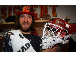 Calgary Flames Mike Smith shows off his new goalie mask for the home opener this Saturday, honouring Flames legend Mike Vernon at the Scotiabank Saddledome in Calgary on Thursday, October 4, 2018. Al Charest/Postmedia
