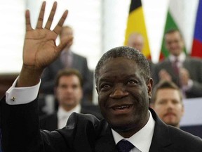 FILE - In this Wednesday Nov. 26, 2014 file photo, Doctor Denis Mukwege, from the Democratic Republic of Congo, a gynecologist who specializes in treating victims of rape and extreme sexual violence, waves as he gets the Sakharov Prize at the European Parliament in Strasbourg eastern France. Mukwege and Nadia Murad have been named the winners of the Nobel Peace Prize on Friday, Oct. 5, 2018.