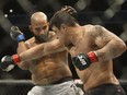 Luis Henrique, right, misses a punch on Arjan Bhullar during their mixed martial arts bout at UFC 215 in Edmonton on Sept. 9, 2017.