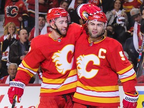 T.J. Brodie, left, celebrates a goal with Mark Giordano earlier this season.