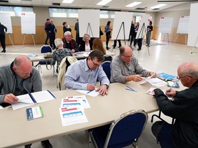 Calgarians take part in a public information open house on a potential Winter Olympic bid for Calgary at the Dalhousie Community Association on Tuesday evening October 16, 2018.  Gavin Young/Postmedia