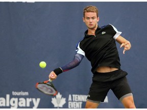 France's Enzo Couacaud plays against  Australian John-Patrick Smith during the National Bank Challenger Tournament in Calgary on Wednesday. The event takes place at the Osten & Victor Alberta Tennis Centre through the weekend.   Photo by Gavin Young/Postmedia.