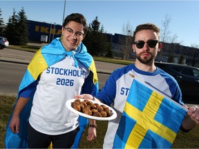 Franco Terrazzano, left, of the Canadian Taxpayers Federation and Generation Screwed representative Lucus Riccioni promote a Swedish bid for the 2016 Winter Olympics outside IKEA in Southeast Calgary on Monday, Oct. 22, 2018.