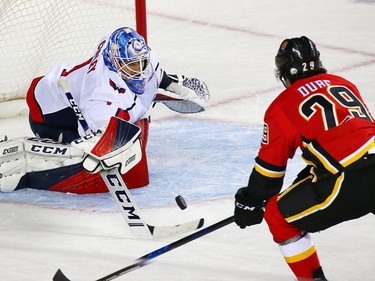 The Calgary Flames' Dillon Dube looks to catch a potential rebound in front of Washington Capitals goaltender Pheonix Copley during NHL action at the Scotiabank Saddledome in Calgary on Saturday October 27, 2018.