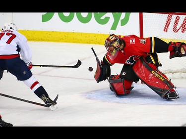 Calgary Flames goaltender Mike Smith stops this breakaway shot by the Washington Capitals' T.J. Oshie during NHL action at the Scotiabank Saddledome in Calgary on Saturday October 27, 2018.