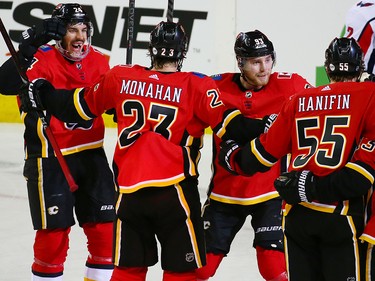 The Calgary Flames' Travis Hamonic far left celebrates with teammates after he scored on the Washington Capitals during NHL action at the Scotiabank Saddledome in Calgary on Saturday October 27, 2018.