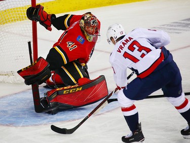 The Washington Capitals' Jakub Vrana scores on Calgary Flames goaltender Mike Smith during NHL action at the Scotiabank Saddledome in Calgary on Saturday.
