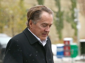 Calgary businessman Ken Carter leaves court in Calgary on Oct. 9, 2018.