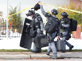 Calgary Police Tactical  and K9 units leave the scene after several people were arrested at a home in the 2200 block of 47th Street S.E. on Friday, Oct. 5, 2018.