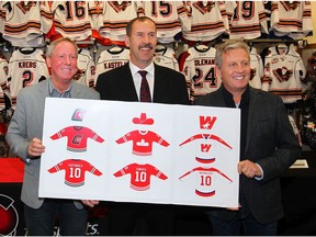 (L-R) Mike Rogers, Jamie Macoun and MIke Vernon pose with artwork at Adrenaline Source for Sports in Calgary on  Wednesday, October 10, 2018. The Calgary Hitmen announced they will play a number of games in the Corral called "The Corral Series" and they will wear replica jerseys of the teams that played in the Calgary Corral. Jim Wells/Postmedia