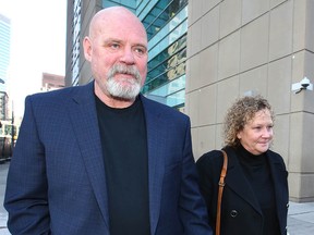 Steve and Heather Walton leave the Calgary Courts Centre in Calgary on Friday, October 19, 2018.