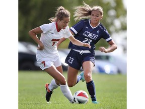 University of Calgary's Damiane Sawatzky (right).