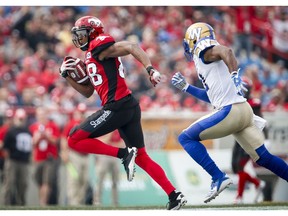 Winnipeg Blue Bombers' Maurice Leggett, right, chases Calgary Stampeders' Kamar Jorden during second half CFL football action in Calgary, Saturday, Aug. 25, 2018.THE CANADIAN PRESS/Jeff McIntosh ORG XMIT: JMC115