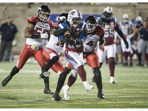 The Montreal Alouettes' Tyrell Sutton (20) runs in for a touchdown during second half CFL football action against the Calgary Stampeders in Montreal, Friday, July 14, 2017.
