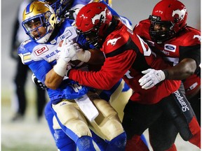 The Stamps will need to wrap up Bombers running back Andrew Harris is they hope to clinch top spot in the West. Postmedia file.