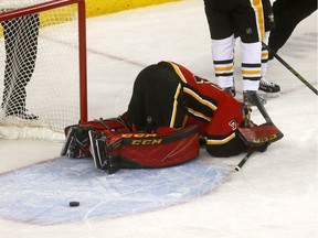 Calgary Flames goalie, Mike Smith reacts after Pittsburgh Penguins second goal in first period action at the Scotiabank Saddledome in Calgary on Thursday October 25, 2018.