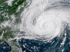This satellite image provided by NOAA shows Hurricane Florence on the eastern coast of the United States on Friday, Sept. 14, 2018.