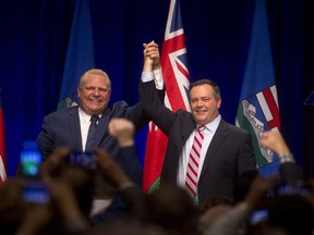 Jason Kenney, UCP leader, right, and Doug Ford during the Scrap the Carbon Tax Rally in Calgary on Friday October 5, 2018. Leah Hennel/Postmedia