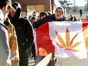 Ryker Rumsey waits in line during the opening at the Premium Four20 Market in Calgary on Wednesday October 17, 2018. Darren Makowichuk/Postmedia