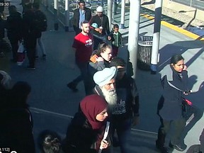Calgary police released this image Monday of people on a train platform following an alleged hate-motivated assault.