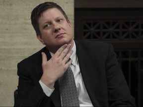 Chicago police officer Jason Van Dyke listens during his trial at the Leighton Criminal Court Building, in Chicago, Friday, Oct. 5, 2018.