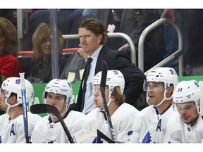 Toronto Maple Leafs coach Mike Babcock watches during the first period of the team's NHL hockey game against the Detroit Red Wings, Thursday, Oct. 11, 2018, in Detroit.