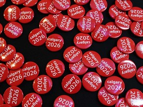Buttons are displayed at the Jack Singer Concert Hall in Calgary on Sept. 20, 2018 during a public engagement session for the Calgary 2026 Olympic bid.