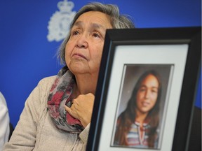 Madeline Lanaro attends a press conference at RCMP headquarters in Surrey, B.C., on Dec. 1, 2014. Her daughter Monica Jack, seen in the framed photo, was murdered.