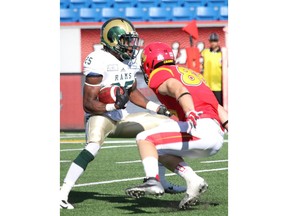 Austen Hartley (right), then of the Calgary Dinos, is now trying to find a spot with the Calgary Stampeders.