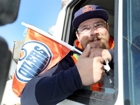 Gregory Stapleton, a snow plow operator for the City of Edmonton, gets ready to help Calgary clean up on Wednesday, Oct. 3, 2018, one day after a storm dumped more than 30 cm of snow.