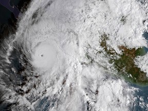 Satellite image provided by NOAA shows Hurricane Willa in the eastern Pacific, on a path toward Mexico's Pacific coast on Monday, Oct. 22, 2018.