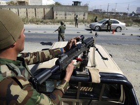 Afghan National army soldiers search a car at a checkpoint ahead of parliamentary elections scheduled for Oct. 20, at the Independent Election Commission compound in Kabul, Afghanistan, Wednesday, Oct. 17, 2018.