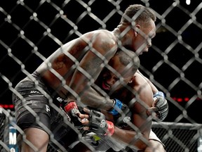 Israel Adesanya of Nigeria (L) fights against Derek Brunson of the United States in their middleweight bout during the UFC 230 event at Madison Square Garden on November 3, 2018 in New York City.