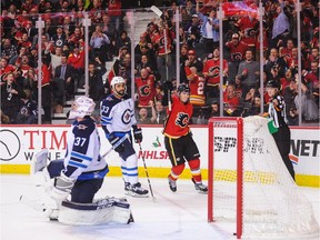 Flames forward Matthew Tkachuk celebrates after scoring against the Winnipeg Jets during an NHL game at Scotiabank Saddledome on Nov. 21, 2018.