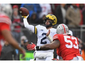 Quarterback Shea Patterson #2 of the Michigan Wolverines passes in the first quarter against the Ohio State Buckeyes at Ohio Stadium on Saturday in Columbus.