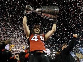 Alex Singleton (49) and the Calgary Stampeders celebrate their Grey Cup win over the Ottawa Redblacks at Commonwealth Stadium, in Edmonton Sunday November 25, 2018. Photo by David Bloom
