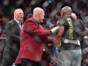 Brock Lesnar (L) confronts Daniel Cormier (R) after his heavyweight championship fight against Stipe Miocic at T-Mobile Arena on July 7, 2018 in Las Vegas, Nevada. Cormier won by first round knockout. (Photo by Sam Wasson/Getty Images)