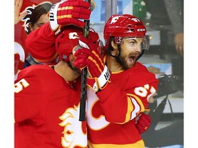 The Calgary Flames' Michael Frolik celebrates with Mark Giordano after Frolic scored his second goal of the night during NHL second period action against the Boston Bruins at the Scotiabank Saddledome in Calgary on Wednesday October 17, 2018.  Gavin Young/Postmedia