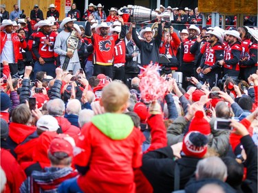 Calgary Stampeders head coach Dave Dickenson joins his team on the stage during a victory rally at Municipal Plaza on Tuesday, Nov. 27, 2018.