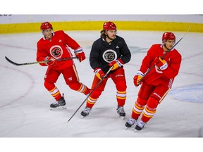 Calgary Flames Austin Czarnik, Rasmus Andersson and Mikael Backlund during practice at the Scotiabank Saddledome in Calgary on Friday, October 5, 2018. Al Charest/Postmedia