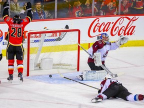 Calgary Flames Elias Lindholm celebrates after James Neal's goal against the Colorado Avalanche in NHL hockey at the Scotiabank Saddledome in Calgary on Thursday, Nov. 1, 2018.