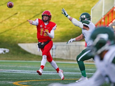 University of Calgary Dinos quarterback Adam Sinagra passes during the Hardy Cup against University of Saskatchewan Huskies at McMahon Stadium on Saturday, November 10, 2018. The Huskies won the game 43-18.