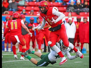 University of Calgary Dinos quarterback Josiah Joseph runs the ball during Hardy Cup action against the University of Saskatchewan Huskies at McMahon Stadium on Saturday, November 10, 2018. The Huskies won the game 43 -18.