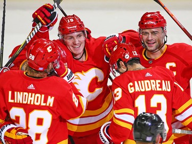 The Calgary Flames' Matthew Tkachuk, centre celebrates the first of two goals he scored in the second period on Montreal Canadiens goaltender Carey Price during NHL hockey action at the Scotiabank Saddledome in Calgary on Thursday November 15, 2018.