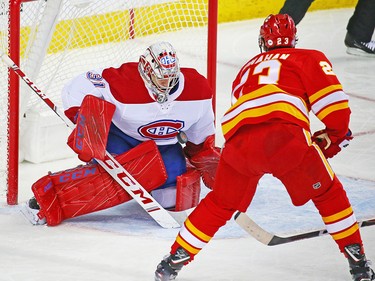 Montreal Canadiens goaltender Carey Price stops this Sean Monahan shot during NHL hockey action against the Calgary Flames at the Scotiabank Saddledome in Calgary on Thursday November 15, 2018.